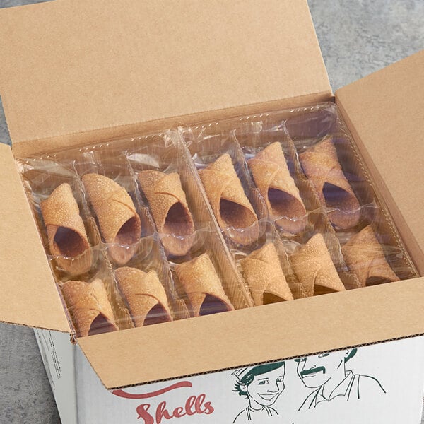 A box of Vaccaro's Desserts Cannoli Shells wrapped in plastic.
