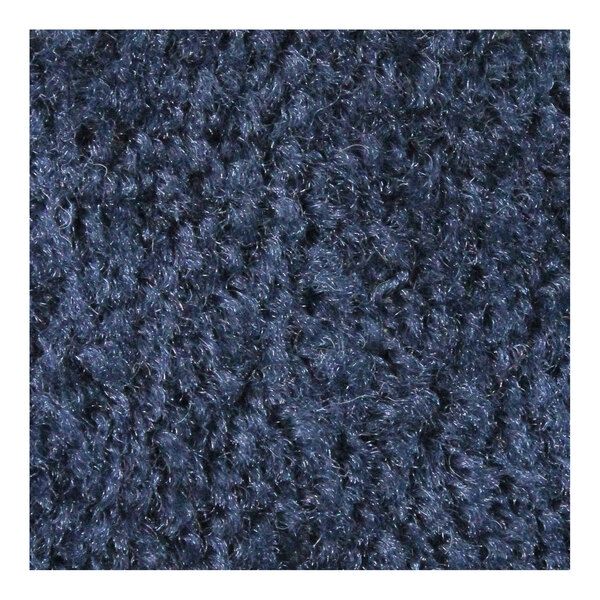A close-up of a navy blue M+A Matting carpet with a rubber border.