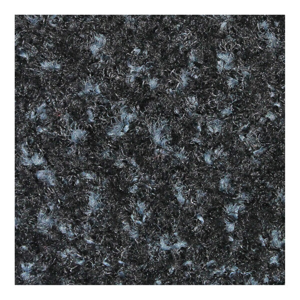 A close-up of a black M+A Matting carpet with a blue and black rubber border.