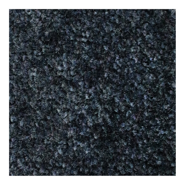 A close up of a navy blue M+A Matting carpet with rubber border.