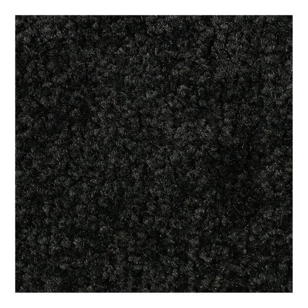 A close up of a black M+A Matting ColorStar carpet with a black rubber border.