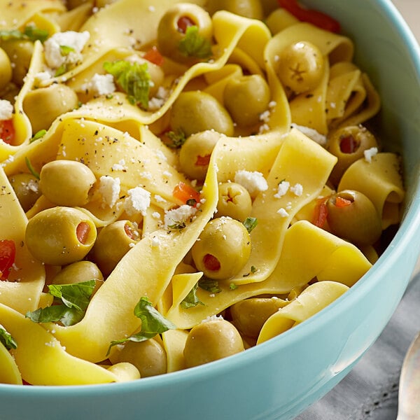 A bowl of pasta with Salad Olives and cheese.