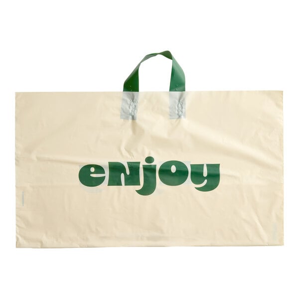 A beige plastic bag with green soft loop handles and the word 'enjoy' printed in green on the front.