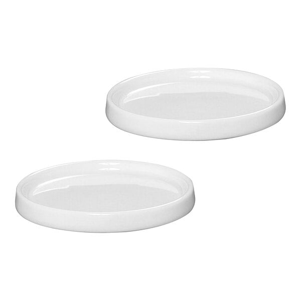 A Zassenhaus ceramic mill coaster set with two white ceramic coasters.