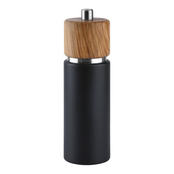 A Zassenhaus olive wood pepper mill with a black and silver metal top and a wooden handle.