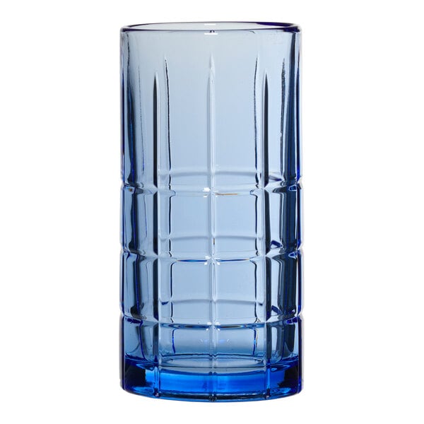 An Anchor Hocking blue glass tumbler with a checkered pattern.