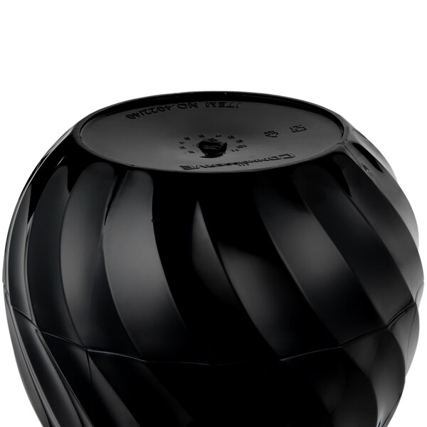 A black Vollrath SwirlServe beverage server on a table.