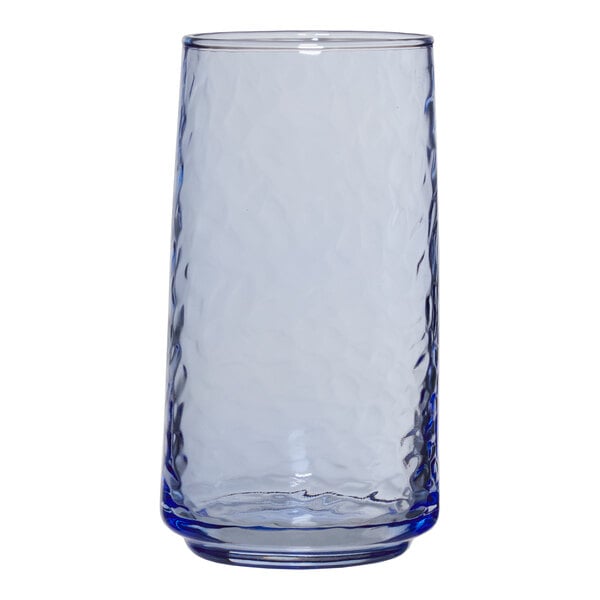 An Anchor Hocking clear glass with a blue rim.