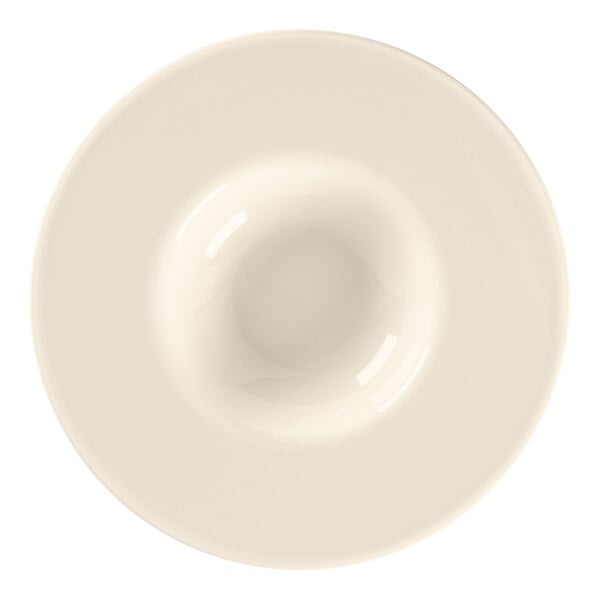 A close-up of a white RAK Porcelain Bravura bone china deep plate with a rim.