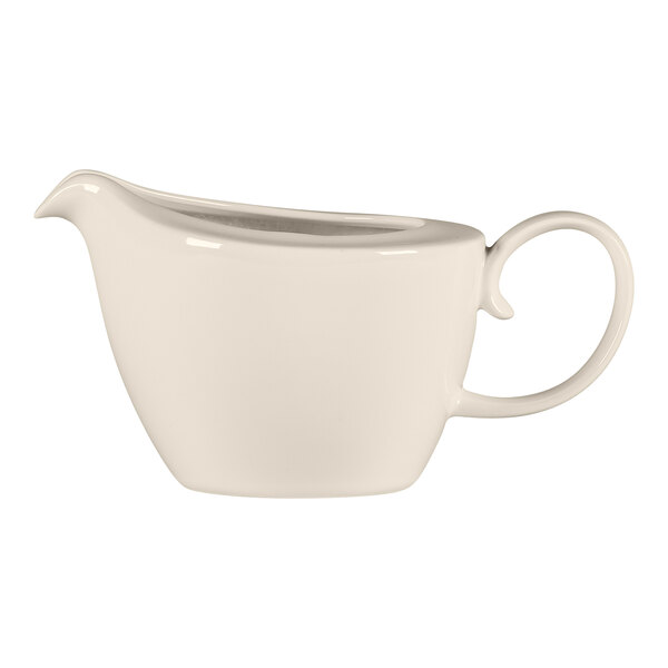 A RAK Porcelain white creamer with a handle.