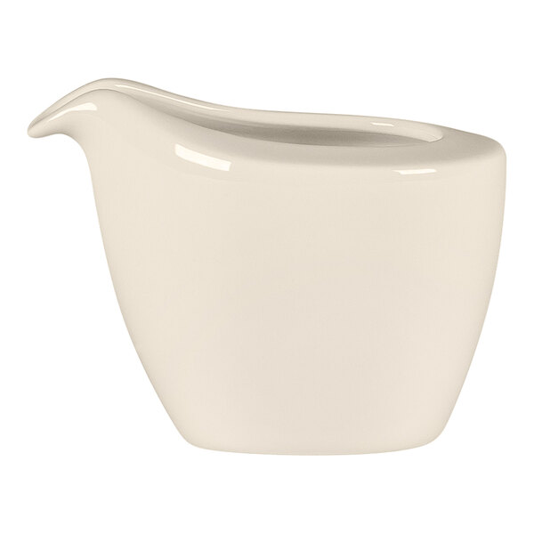 A RAK Porcelain white ceramic pitcher with a spout and no handle.