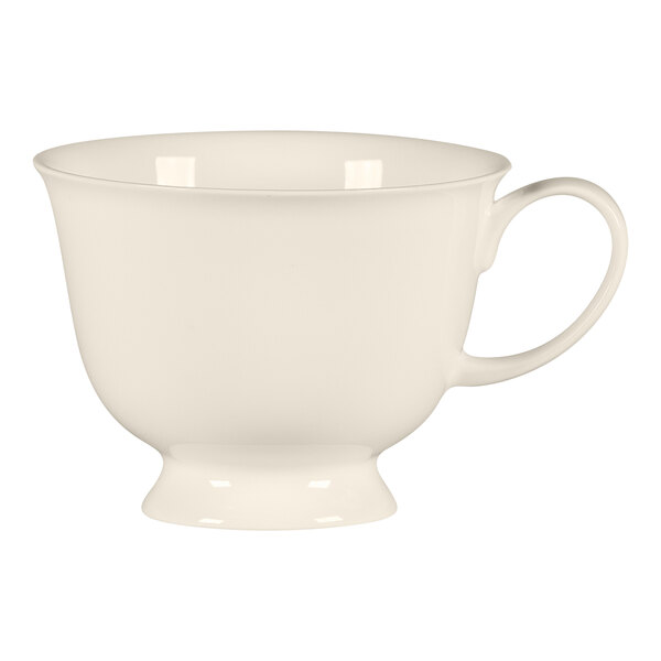 A close-up of a white RAK Porcelain Bravura footed tea cup with a handle.