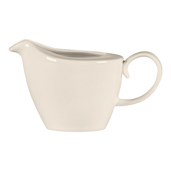 A white RAK Porcelain creamer with a handle.