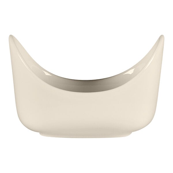 A white RAK Porcelain sugar packet holder with a curved edge.