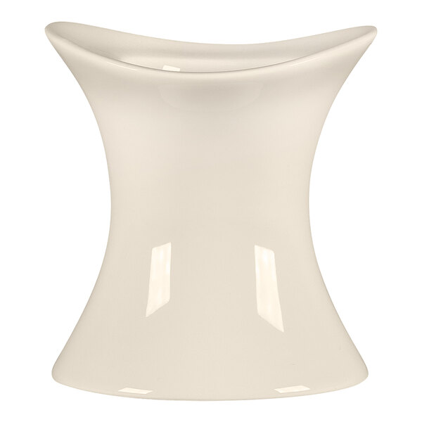 A white bone china egg cup with a curved neck.