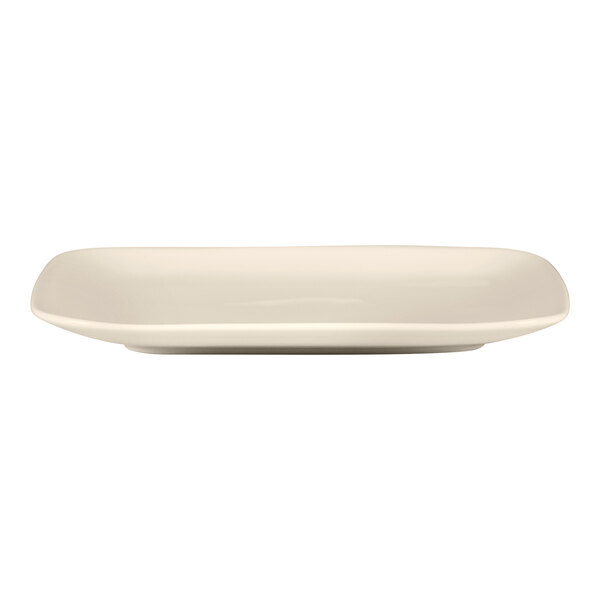 A white square RAK Porcelain Bravura bone china plate with a curved edge.