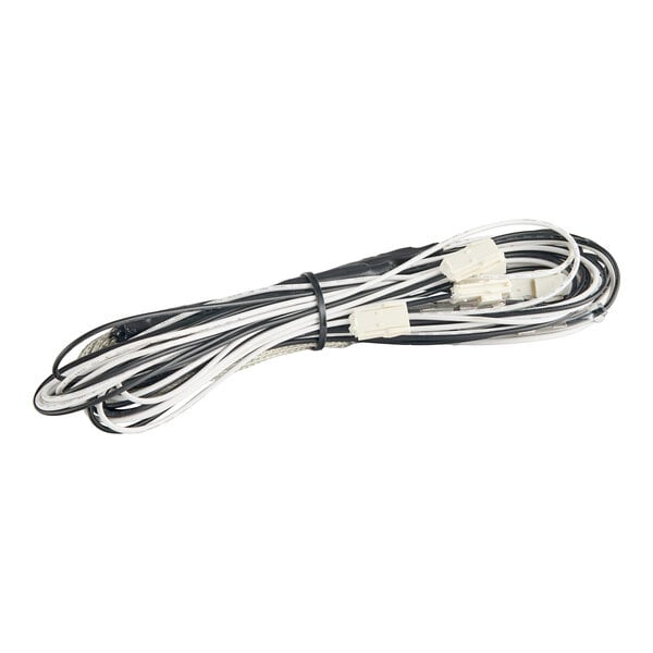 A coiled drain line heater with white and black wires and connectors, designed for select AUF series freezers.