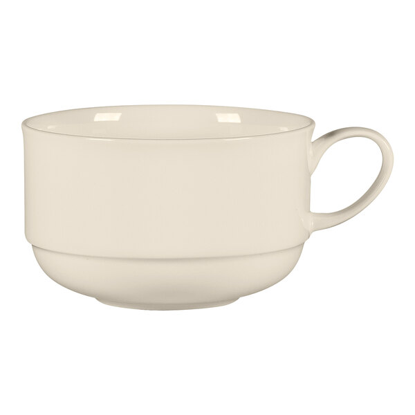 A close-up of a RAK Porcelain white bone china breakfast cup with a handle.