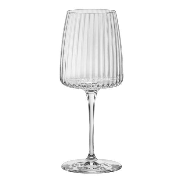 A clear Bormioli Rocco Exclusiva wine glass with a long stem.