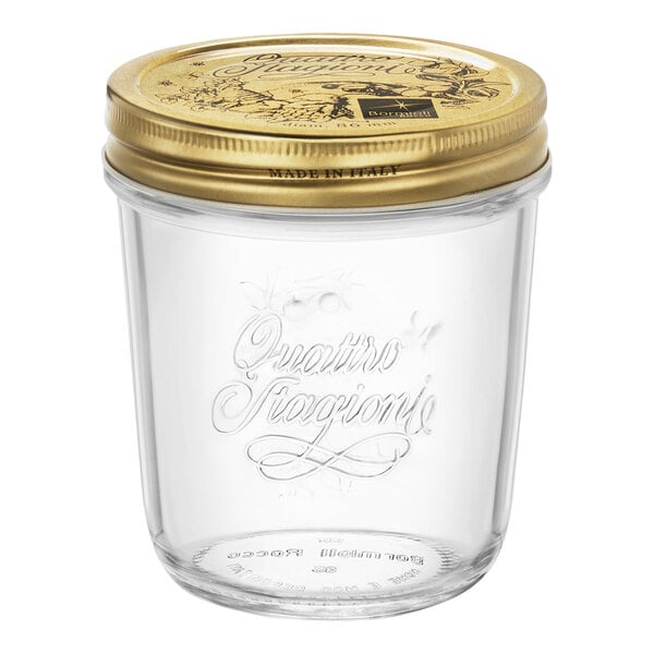 A Bormioli Rocco Quattro Stagioni clear glass jar with a gold lid.