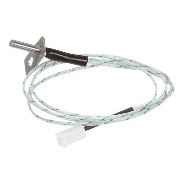 A white wire and green wire with metal connectors on the ends.