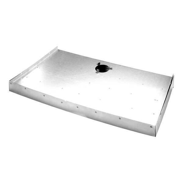 A metal plate with holes in it, with a hole in the middle.