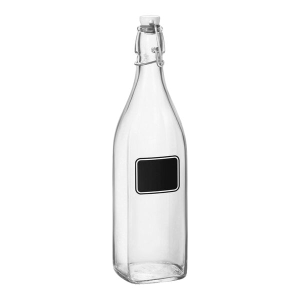 A clear glass Bormioli Rocco Swing Top bottle with a black rectangle for writing.
