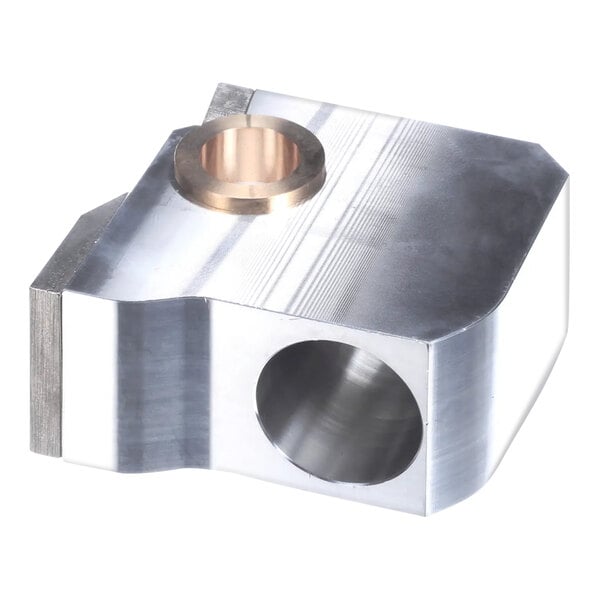 A metal knuckle assembly with a hole in it.
