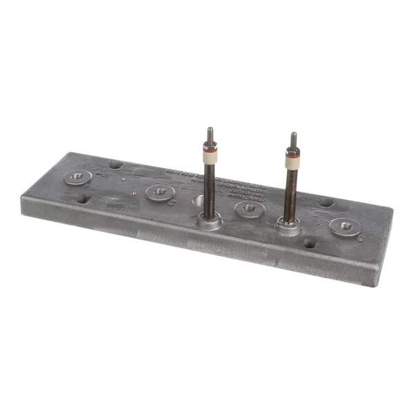 A metal plate with screws on a Garland / US Range front heater casting.