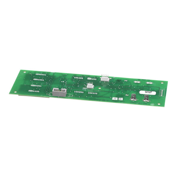 A green circuit board with many small components.