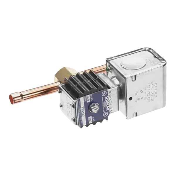 A close-up of a Follett solenoid valve with a copper tube.