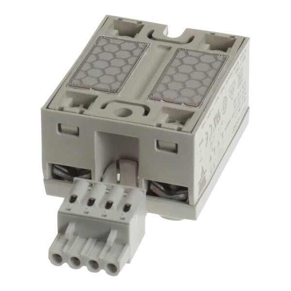 A white rectangular Garland / US Range SSR with metal connectors.