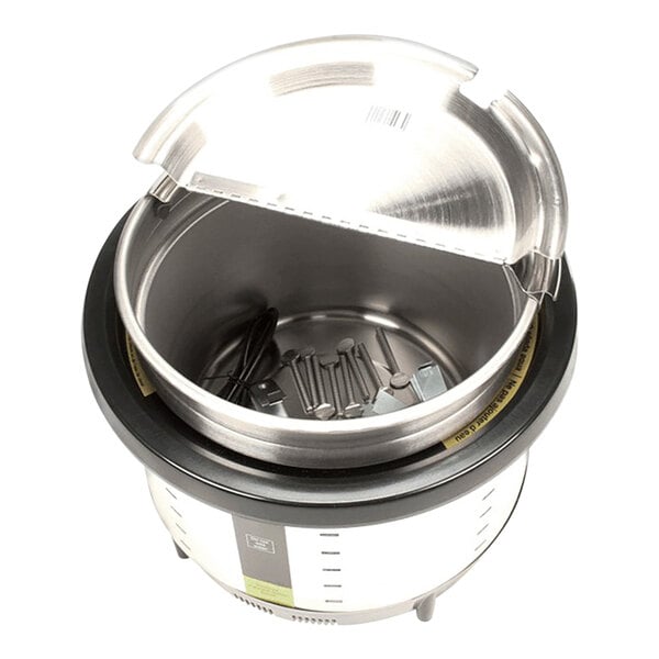 A stainless steel Vollrath drop-in warmer with a lid on top.