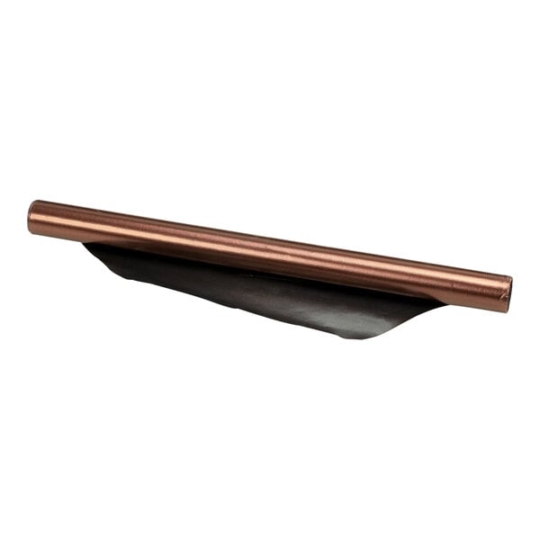 A copper colored metal sheet with a black strip.