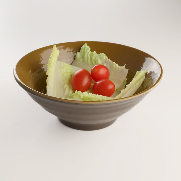 An Elite Global Solutions Pebble Creek Tapenade-colored melamine bowl filled with lettuce and tomatoes.