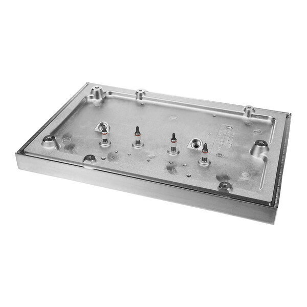A metal rectangular Garland / US Range platen heater with holes and screws.