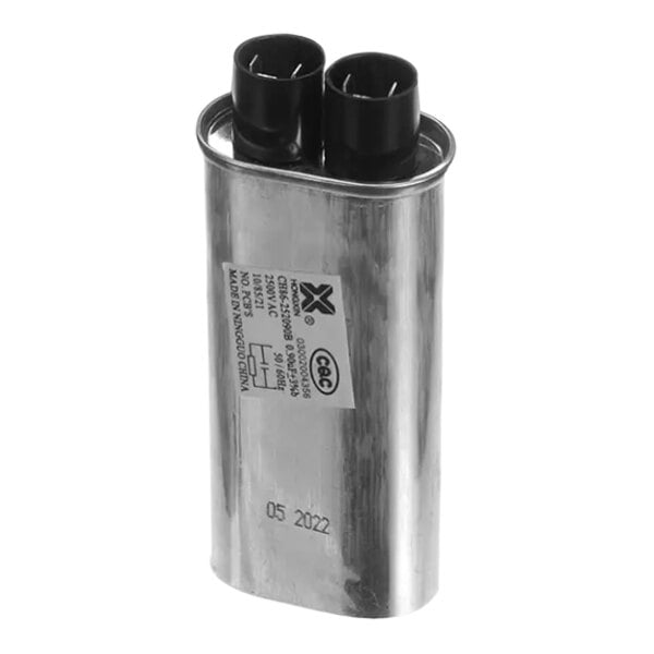 A silver metal Merrychef 0.90Uf capacitor with black wires.