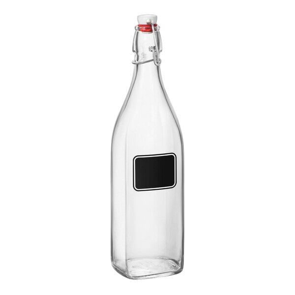 A clear glass Bormioli Rocco Swing bottle with a black label.