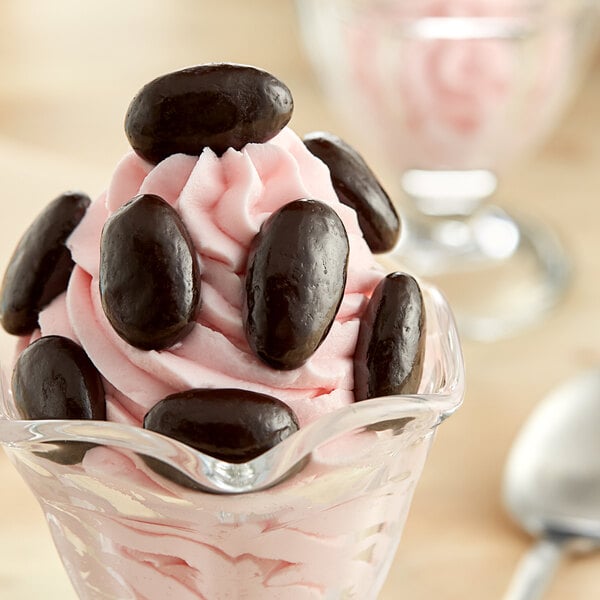 A close up of Albanese dark chocolate covered almonds.