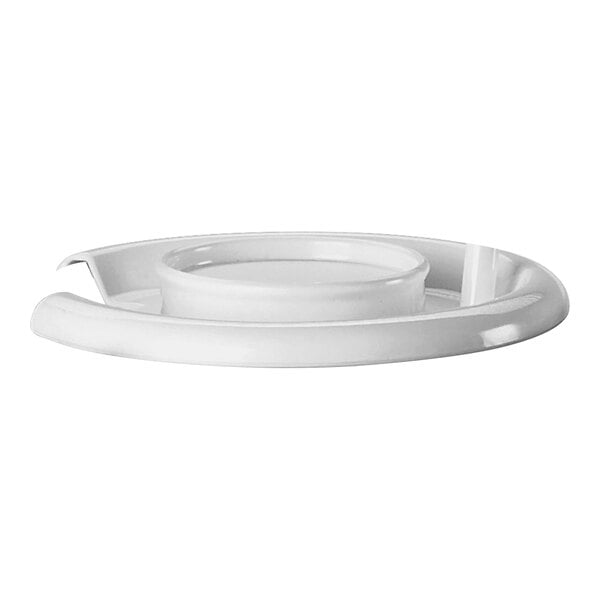 A white plastic lid on a white plate.