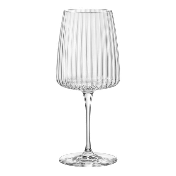 A clear Bormioli Rocco Exclusiva wine glass with a long stem.