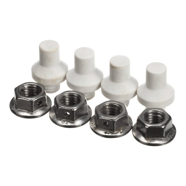 A close-up of four white plastic nuts and bolts.