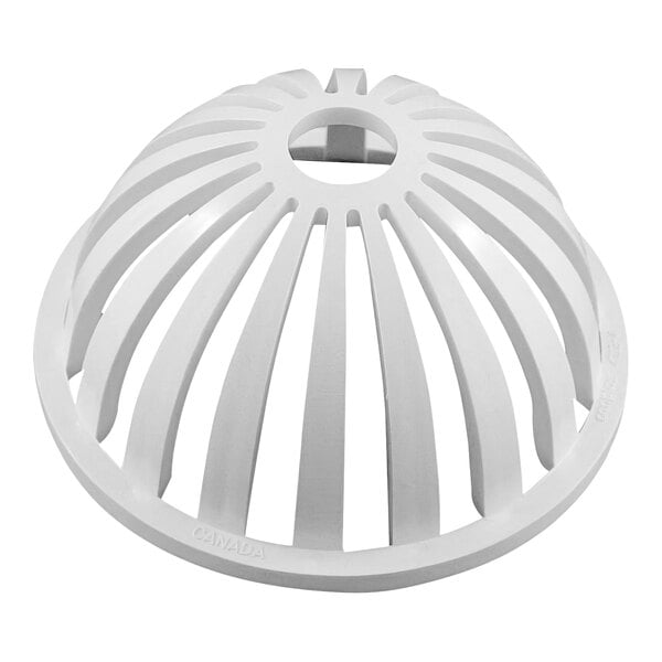 A white plastic domed drain strainer with a circular design and holes.