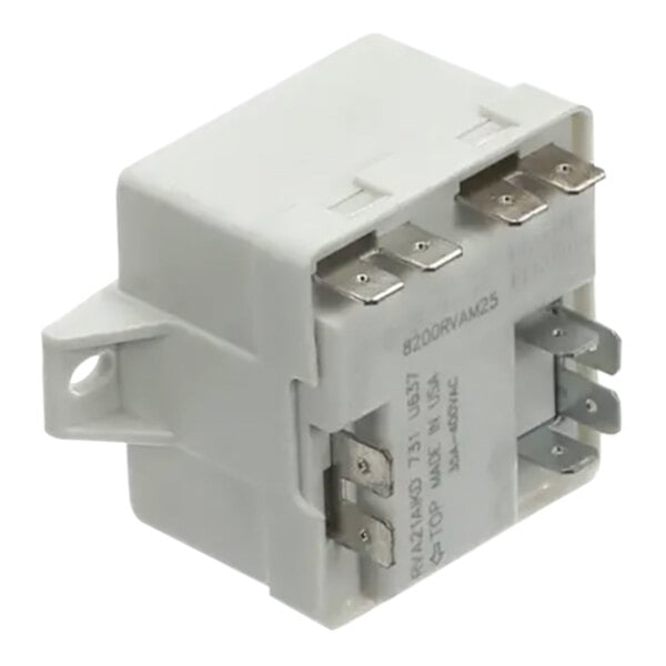 A white Follett Corporation Relay Start with metal terminals.