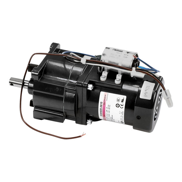 A black electric motor with wires and a wire harness.