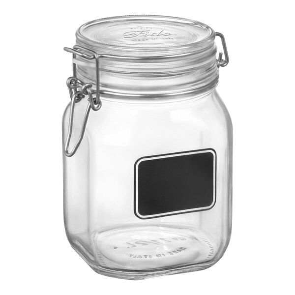 A Bormioli Rocco Fido clear glass storage jar with a black rectangular chalkboard label.