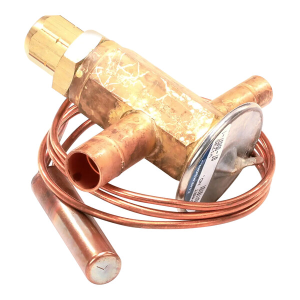An Ice-O-Matic copper pressure valve with a copper pipe and round cap.