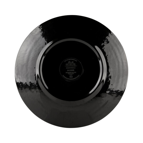 A black plate with a circular logo on it.