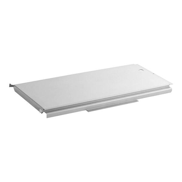 A rectangular metal panel with a smooth surface, slightly raised edges, and a small round hole near one corner.