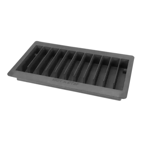 A black plastic drain pan assembly with holes.